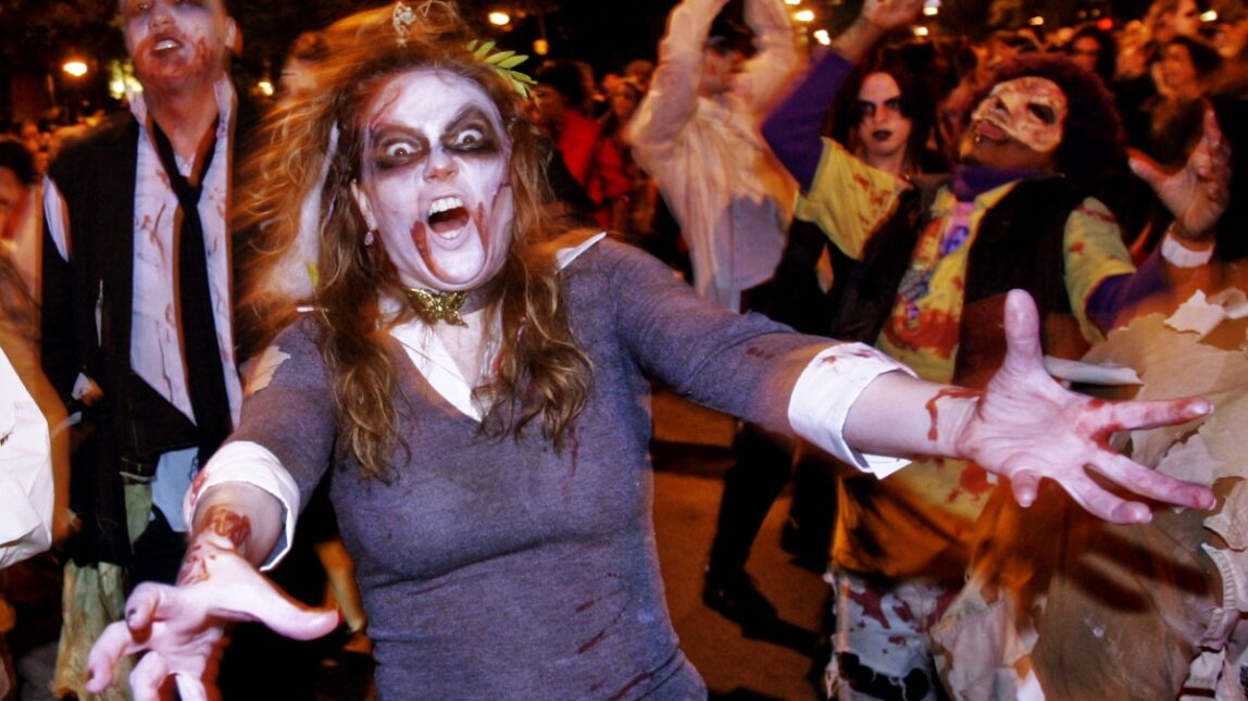A woman dressed as a zombie marches in Greenwich Village's Halloween parade, Friday, Oct. 31, 2008 in New York. (AP Photo/Dima Gavrysh)
