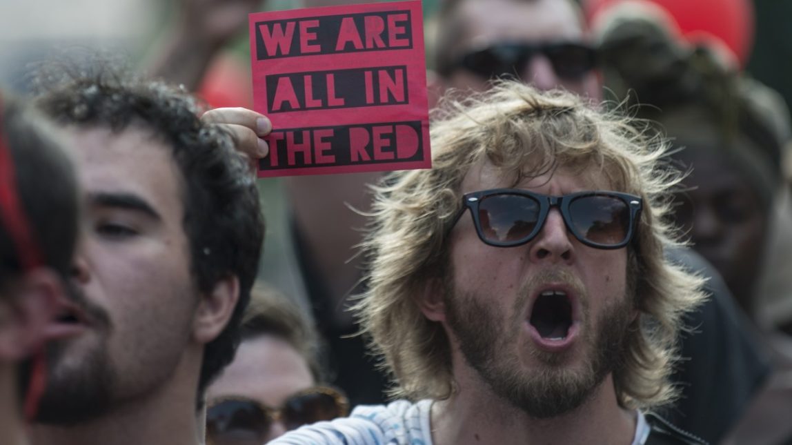 An Occupy activist marches through the streets of Philadelphia July 1, 2012. (Mannie Garcia/MintPress)