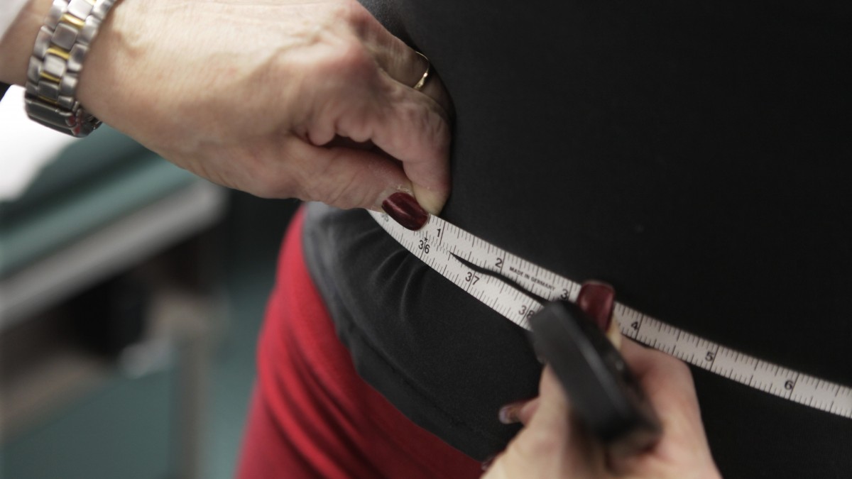 In this photo taken Jan. 20, 2010, Paris Woods, has her waist measured as she takes part in her final session of a 20 month obesity prevention study at Rush University Medical Center in Chicago. (AP Photo/M. Spencer Green)