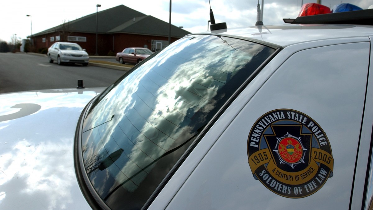 A Pennsylvania State Police car blocks an entrance to the Ephrata State Police barracks, Wednesday, Feb. 23, 2005, in Ephrata, Pa. (AP Photo/Carolyn Kaster)