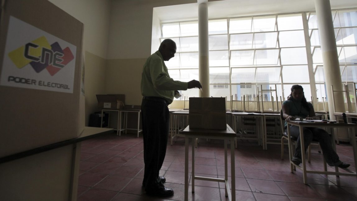 A man casts his ballot during and election. (AP Photo/Fernando Llano)