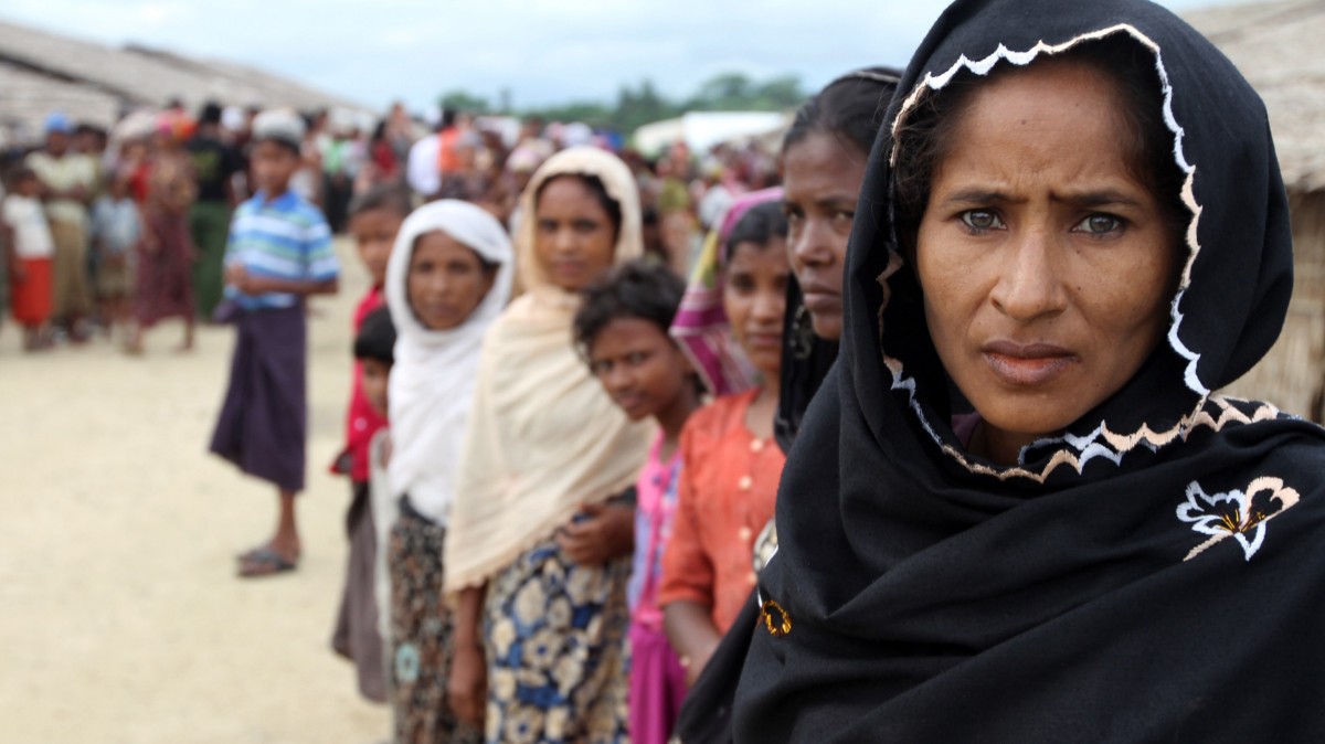 In this photo taken on Sept.8, 2012, Muslims gather during the visiting of Derek Mitchell, unseen, the US ambassador to Myanmar, and diplomats at their refugee camp in Sittwe, Rakhine State, western Myanmar. (AP Photo/Khin Maung Win)