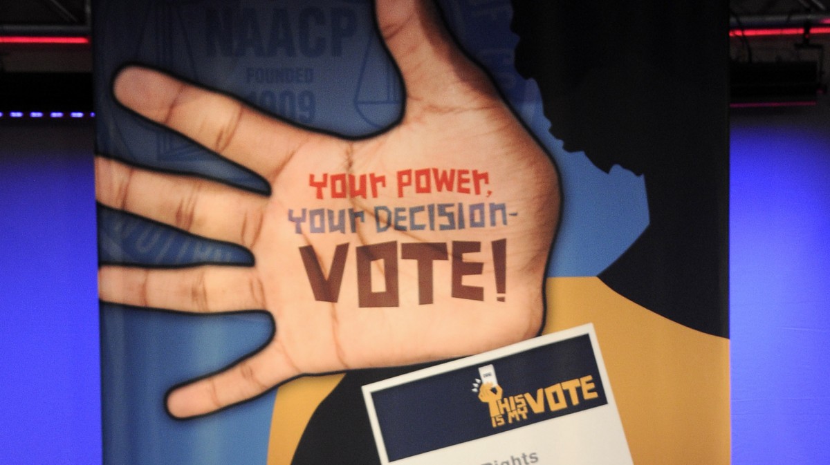 A banner is shown at the NAACP annual convention Tuesday, July 10, 2012, in Houston. (AP Photo/Pat Sullivan)