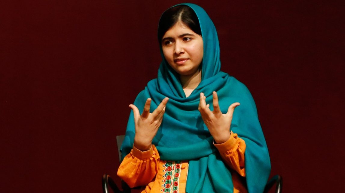 Malala Yousafzai gestures as she speaks to an audience during a discussion of her book, "I am Malala" hosted by the John F. Kennedy Library and held at Boston College High School Saturday, Oct. 12, 2013, in Dorchester, Mass. (AP Photo/Jessica Rinaldi)