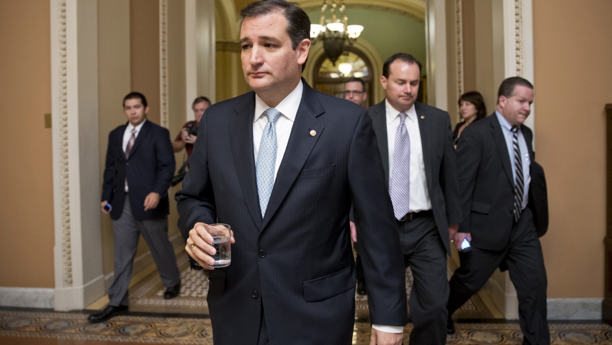 Tea party conservatives Sen. Ted Cruz, R-Texas, and Sen. Mike Lee, R-Utah, right, walk to a Senate meeting.