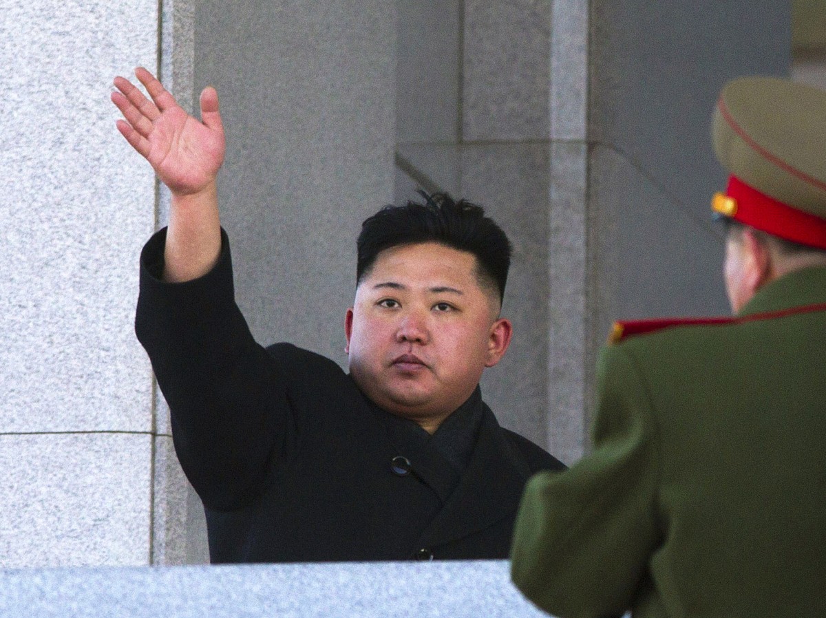 New North Korean leader Kim Jong Un waves at Kumsusan Memorial Palace in Pyongyang after reviewing a parade of thousands of soldiers and commemorating the 70th birthday of his late father Kim Jong Il on Thursday, Feb. 16, 2012. (AP Photo/David Guttenfelder)