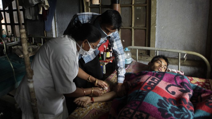 A tuberculosis patient receives treatment at the TB Hospital in Gauhati, India, Saturday, March 24, 2012. India's inadequate government-run tuberculosis treatment programs and a lack of regulation of the sale of drugs that fight the disease are responsible for the spiraling number of drug-resistant cases that are difficult to treat, health activists said Friday. India adds an estimated 99,000 cases of drug-resistant TB every year.  (AP Photo/Anupam Nath)