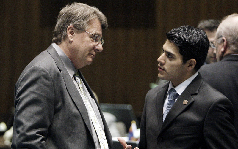 FILE - In this June 30, 2009 file photo, Rep. Steve Yarbrough, R-Chandler, left, and Rep. Steve Montenegro, R-Litchfield Park, talk on the house floor during the continued budget impasse at the Arizona State Capitol in Phoenix. An Arizona Senate committee gave initial approval Thursday, Jan. 16, 2014 to a bill allowing people to claim that their religious beliefs led them to refuse service to gays or others. The bill pushed by Republican Sen. Steve Yarbrough, R-Chandler, is a new version of a measure that was a vetoed last year. (AP Photo/Ross D. Franklin, file)