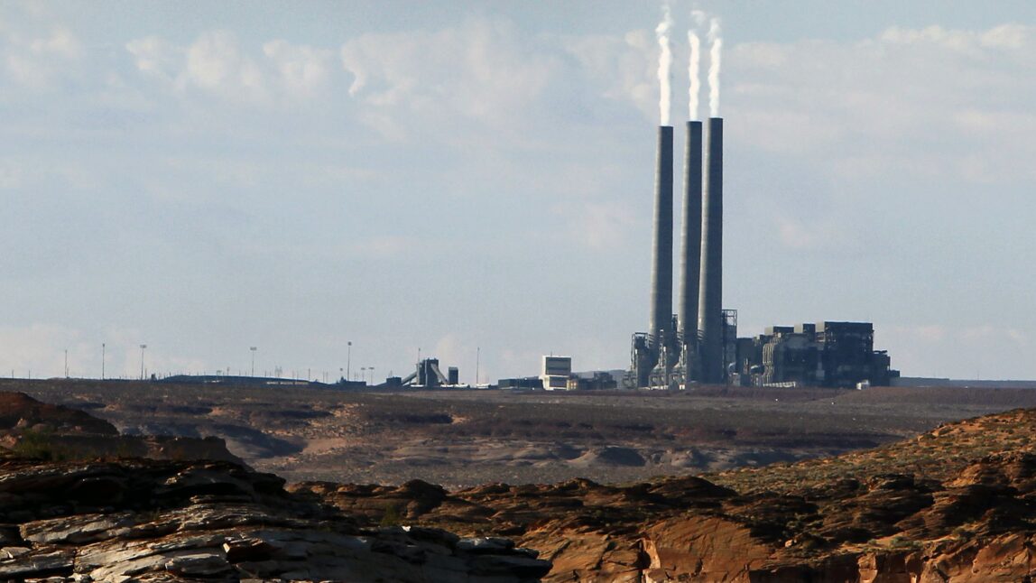 A coal-burning facility at the Navajo Generating Station, as seen from Lake Powell in Page, Ariz. (AP Photo/Ross D. Franklin, File)