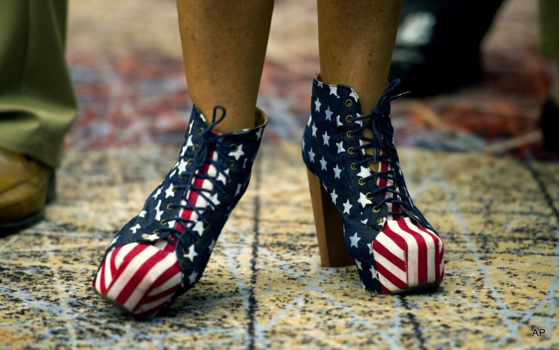 Alice Butler-Short, a supporter of Virginia Republican Senate candidate Ed Gillespie displays her American flag shoes while she waits for poll results at the election night party at Embassy Suites hotel in Springfield, Va., Tuesday, Nov. 4, 2014. (AP Photo/Cliff Owen)