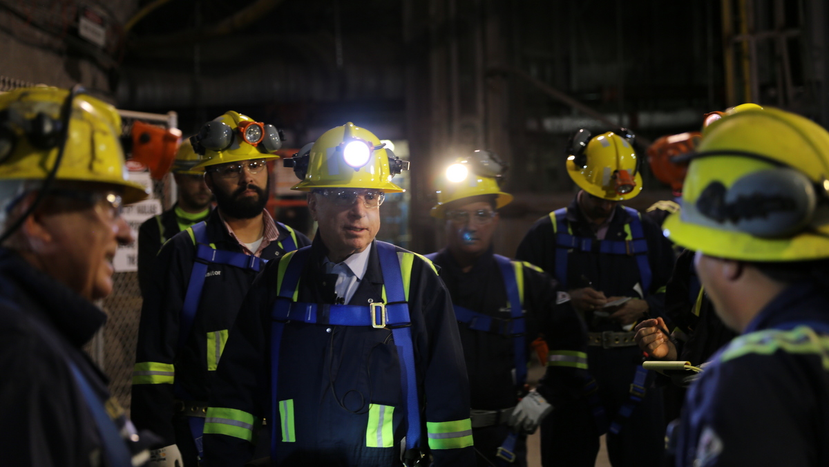 Senator John McCain speaks with miners during a tour of the Resolution Mining Copper Facility in Tonto National Forest, Arizona. (Photo Credit: Resolution Copper Mining)