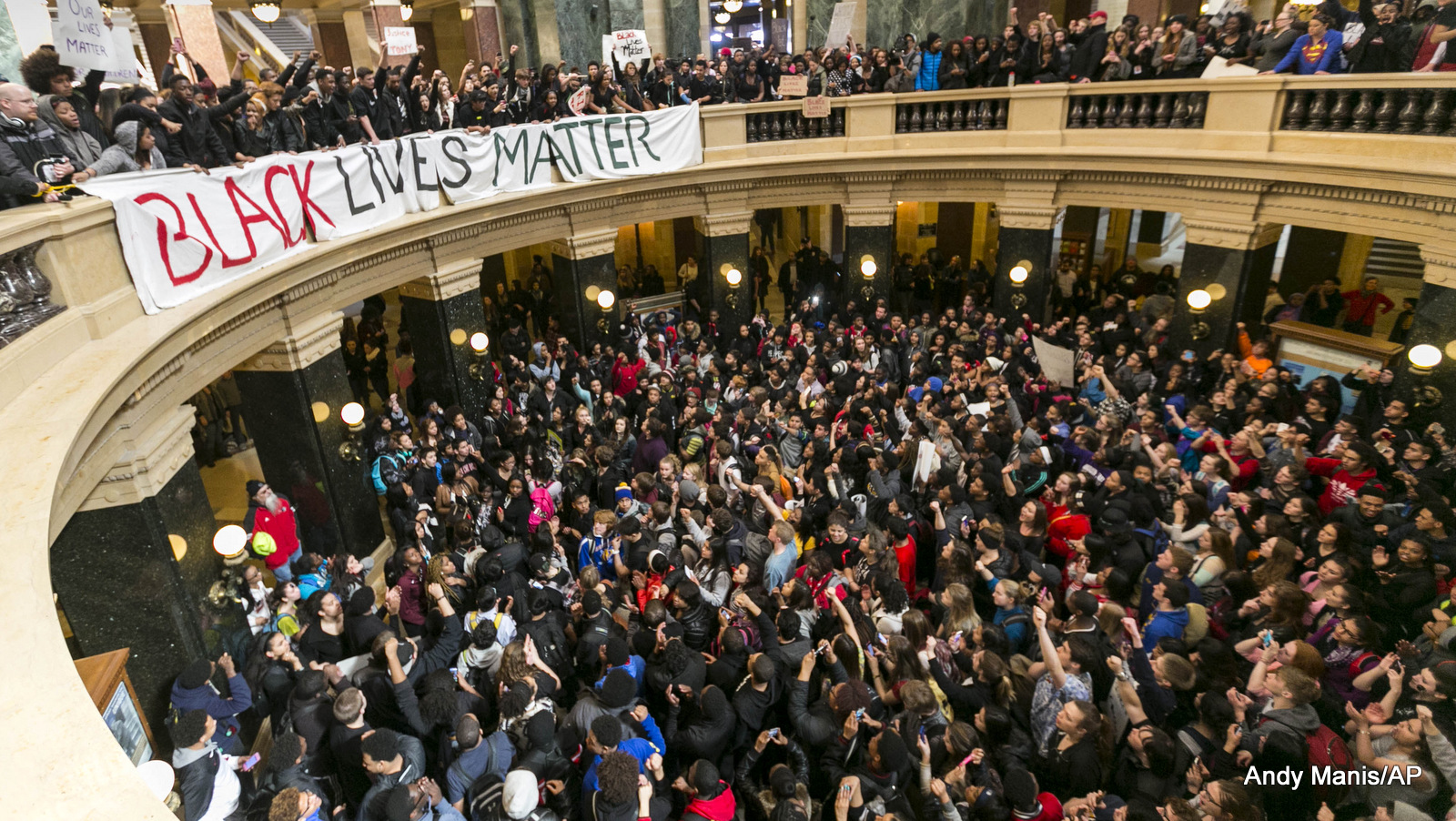 Demonstrators protest the shooting of Tony Robinson at the state Capitol Monday, March 9, 2015, in Madison, Wis. The officer who killed the unarmed black man was recently cleared of charges in the shooting. 