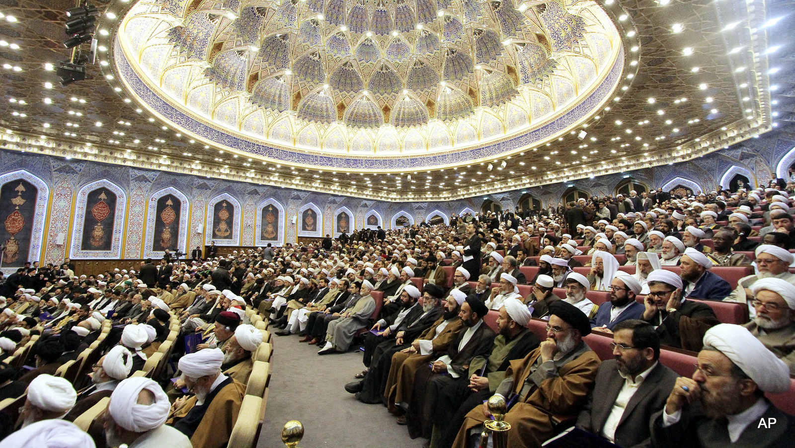 Participants sit in an anti-extremism conference in the city of Qom, 78 miles (125 kilometers) south of the capital Tehran, Iran, Sunday, Nov. 23, 2014. Shiite and Sunni clerics from about 80 countries gathered in Iran's holy city of Qom to develop a strategy to combat extremists including the Islamic State group that has captured large parts of Iraq and Syria. (AP Photo/Mehr News Agency, Zoheir Seidanloo)