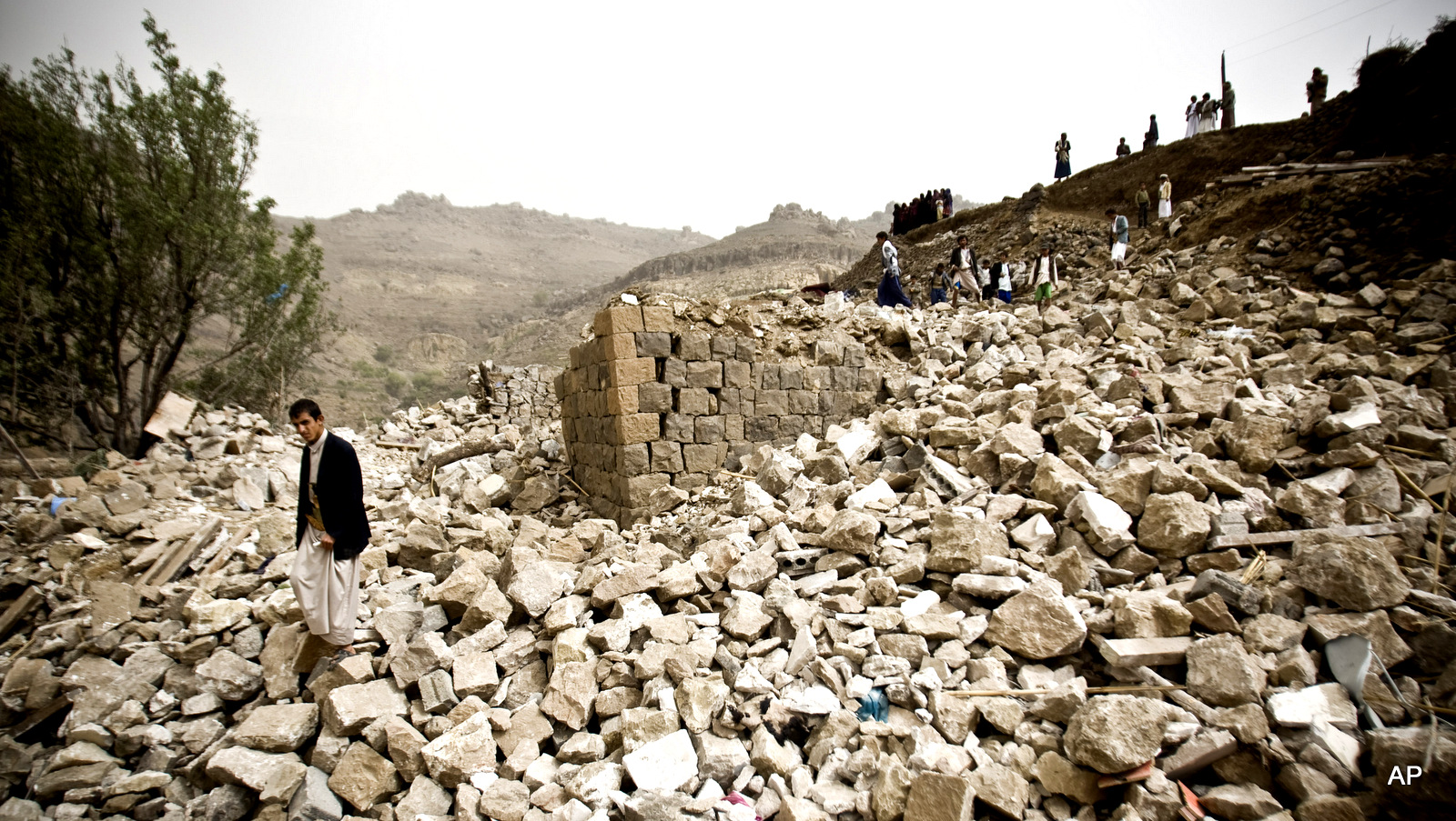 Yemenis search for survivors in the rubble of houses destroyed by Saudi-led airstrikes in a village near Sanaa, Yemen. Since their advance began last year, the Shiite rebels, known as Houthis have overrun Yemen's capital, Sanaa, and several provinces, forcing the country’s beleaguered President Abed Rabbo Mansour Hadi to flee the country. The Saudi-led coalition continued to carry out intensive airstrikes overnight and early Saturday morning targeting Houthi positions.