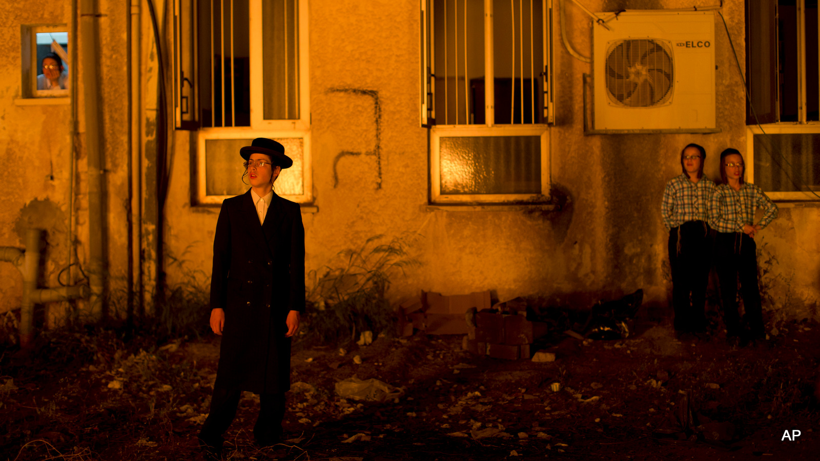 Ultra-Orthodox Jewish youth watch a bonfire in the ultra-Orthodox Jewish town of Bnei Brak, near Tel Aviv, Israel, Wednesday, May 6, 2015, during the Lag Ba'Omer holiday, marking the end of a plague said to have decimated Jews during the Roman times.