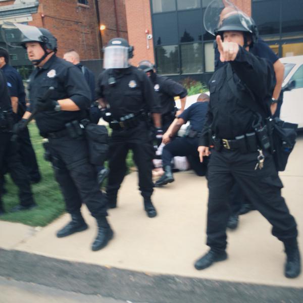 Denver Police confront people protesting the killing of Paul Castaway. Denver, Colorado June, 20 2015. Photo: Jesse Benn/Twitter