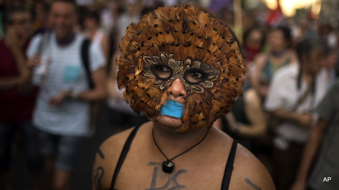 A protestor takes part in a march against the Public Security Law "gag law" in Madrid, Spain