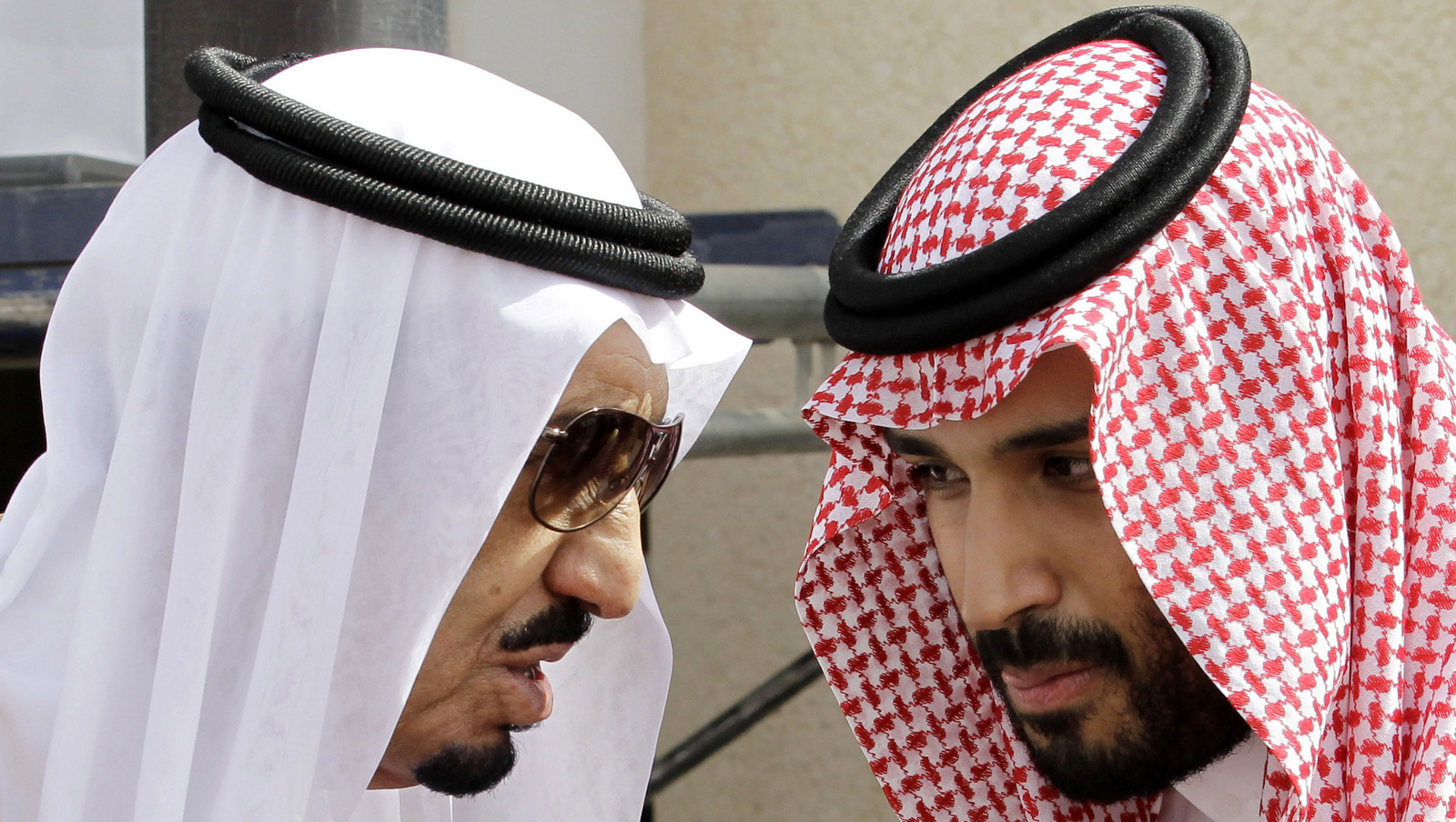 In this Monday, May 14, 2012 file  photo, then Crown Prince Salman, left, speaks with his son Prince Mohammed bin Salman as they wait for Gulf Arab leaders ahead of the opening of a Gulf Cooperation Council summit, in Riyadh, Saudi Arabia. On Wednesday, April 29, 2015, Prince Mohammed was appointed deputy crown prince, placing him second in line for the crown. He is believed to be around 30 years old, and as defense minister has assumed a leading role in the Saudi-led air campaign against Shiite rebels in Yemen. (AP Photo/Hassan Ammar, File)