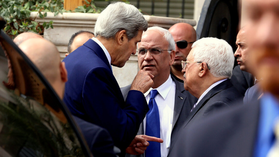 U.S. Secretary of State John Kerry, center left speaks with Palestinian President Mahmoud Abbas center right, and close aide to Abbas, Saeb Erekat, center, after their meeting at Abbas' residence in Amman, Jordan, Saturday, Oct. 24, 2015. Kerry said Saturday that Israel and Jordan have agreed on steps aimed at reducing tensions at a holy site in Jerusalem that have fanned Israeli-Palestinian violence. (AP Photo/Raad Adayleh)