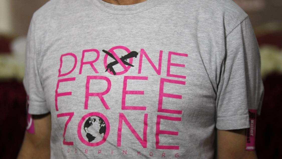 Faisal Ali Bin Jaber, a relative of victims of drone strikes, wears a shirt with anti-drone strike slogans as he attends the opening ceremony of the National Organization for the Victims of Drones in Sanaa, Yemen, Tuesday, April 1, 2014.
