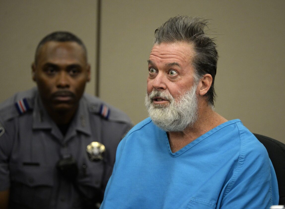 Robert Lewis Dear talks to Judge Gilbert Martinez during a court appearance on Wednesday, Dec. 9, 2015, in Colorado Springs, Colo. Dear, accused of killing three people and wounding nine others at a Colorado Springs Planned Parenthood clinic on Nov. 27, was charged with first-degree murder. (Andy Cross/The Denver Post via AP, Pool) (Associated Press)