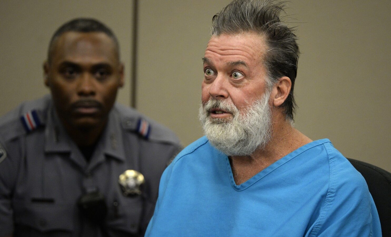 Robert Lewis Dear talks to Judge Gilbert Martinez during a court appearance on Wednesday, Dec. 9, 2015, in Colorado Springs, Colo. Dear, accused of killing three people and wounding nine others at a Colorado Springs Planned Parenthood clinic on Nov. 27, was charged with first-degree murder. (Andy Cross/The Denver Post via AP, Pool) (Associated Press)