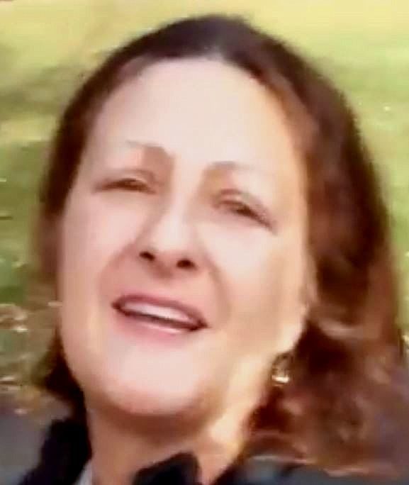 Denise Slader, who works for the California Department of Corrections, is the woman identified in the video.