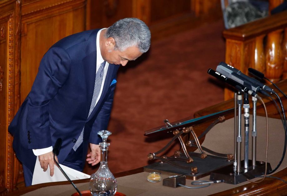 Japanese Economy Minister Akira Amari brows before answering questions at the upper house of the parliament in Tokyo, Thursday, Jan. 28, 2016. Later, Amari said he intends to resign due to allegations he accepted bribes from a construction company in a nationally televised news conference. Photo: Shizuo Kambayashi, AP
