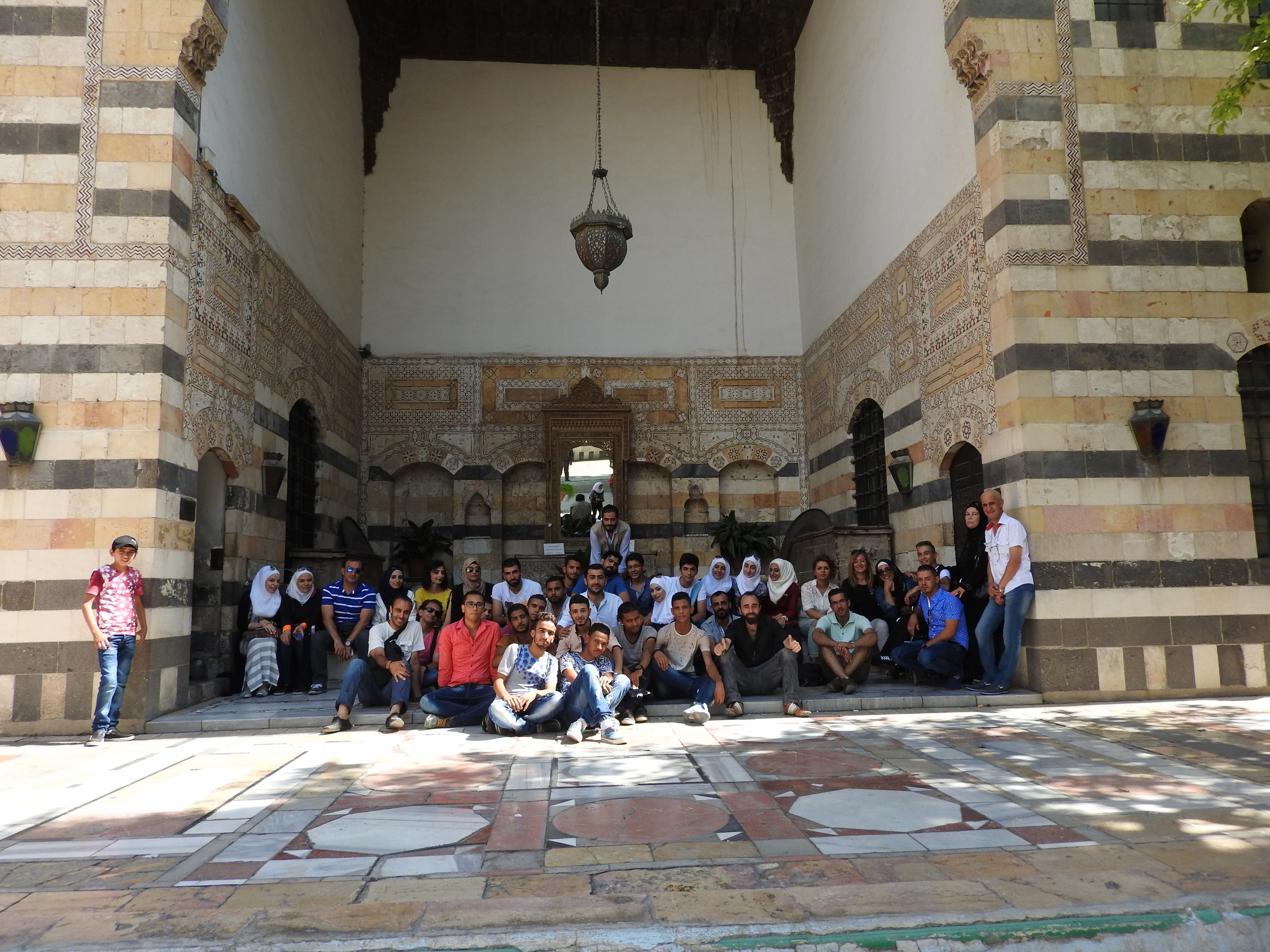  Volunteers from the Saaed Association relax after the second day of 'Eid activities for children. Instead of clothes or money, “we gave children hope and joy,” one volunteer said. In contrast to the sectarianism imposed on Syria by Gulf States and Turkey, Syrians maintain their unity and secularism, emphasized by such volunteers whose allegiance is to humanitarism and helping the less fortunate.