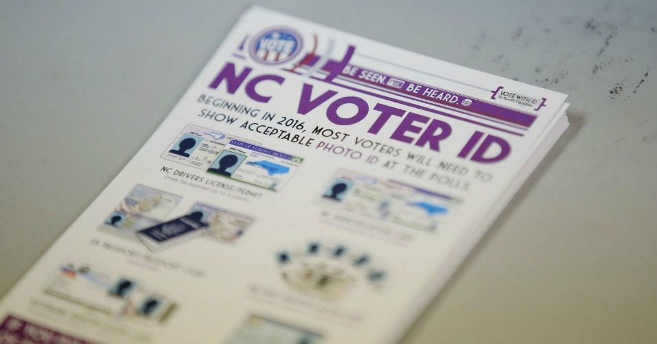Government pamphlets explaining the recently struck-down voter ID law at a polling station in North Carolina earlier this year. (Photo: Chris Keane/Reuters)