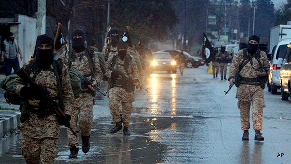 ISIS fighters patrol the streets in Syria's 6th largest city, Deir Az Zor.