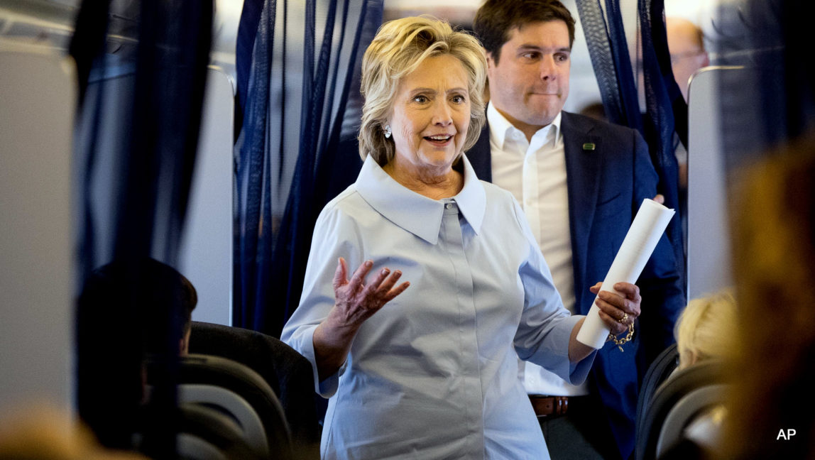 Democratic presidential candidate Hillary Clinton walks back to speak to reporters on her first flight on a new campaign plane before taking off at the Westchester County Airport in White Plains, N.Y., Monday, Sept. 5, 2016, to travel to Cleveland Hopkins International Airport for Labor Day events.