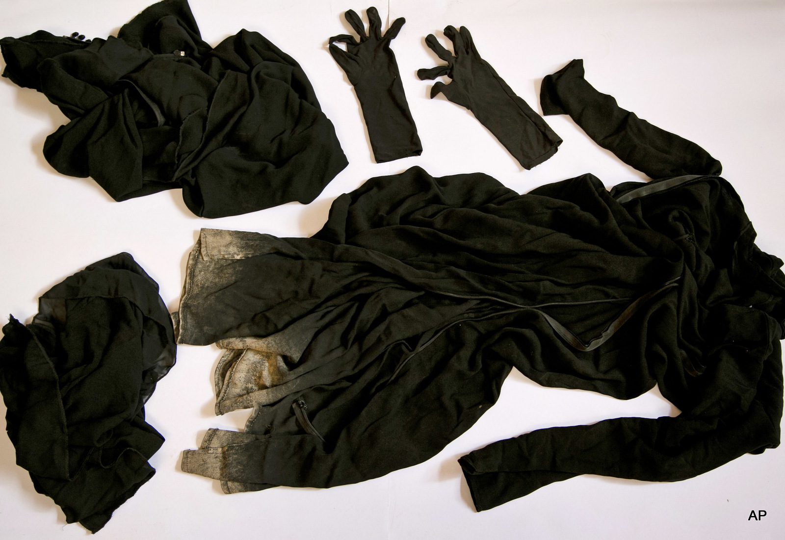 Clothing worn by a Yazidi girl enslaved by ISIS militants, collected by a Yazidi activist to document Islamic State group crimes against the community, shown in this file photo taken May 22, 2016, in Dohuk, northern Iraq.
