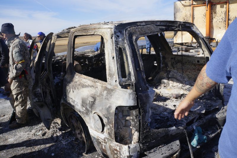 The remnants of a vehicle burned on North Dakota Highway 1806 on the night of Oct. 27. Non-peaceful forces embedded on the side of the water protectors were seen burning the vehicle and two armored vehicles over the protests of water protectors. (Derick Broze for MintPress) 
