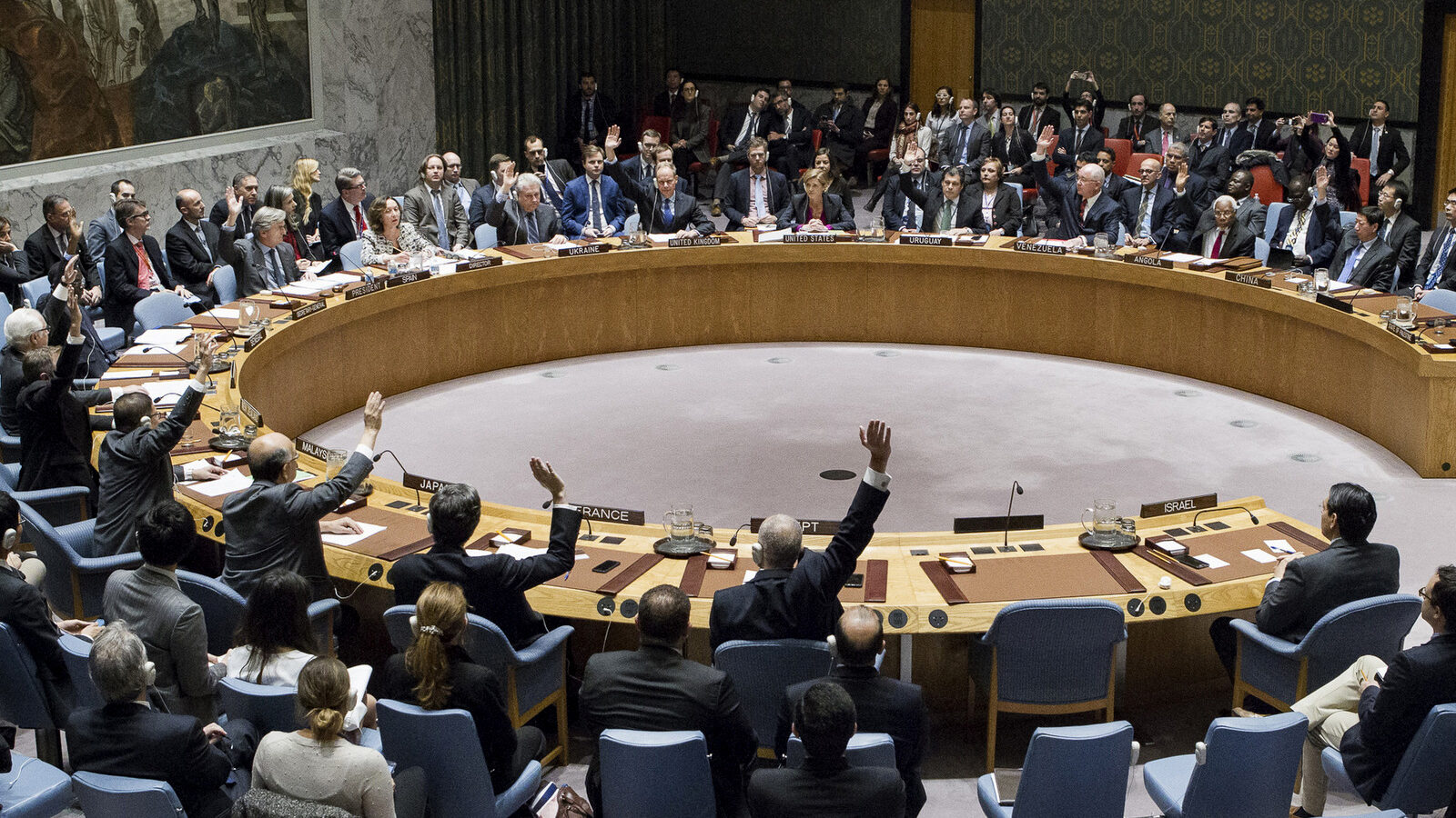 In this photo provided by the United Nations, members of the United Nations Security council vote at the United Nations headquarters on Friday, Dec. 23, 2016, in favor of condemning Israel for its practice of establishing settlements in the West Bank and east Jerusalem. In a striking rupture with past practice, the U.S. allowed the vote, not exercising its veto. (Manuel Elias/The United Nations via AP)