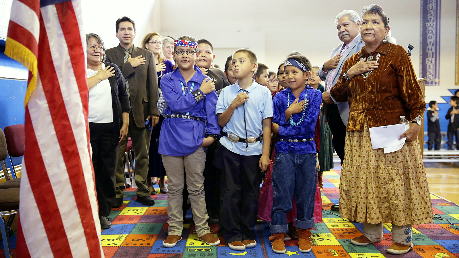 In this Sept. 26, 2014 file photo, students and faculty recite the "Pledge of Allegiance" during an assembly at the Crystal Boarding School in Crystal, N.M., on the Navajo Nation. (AP/John Locher)