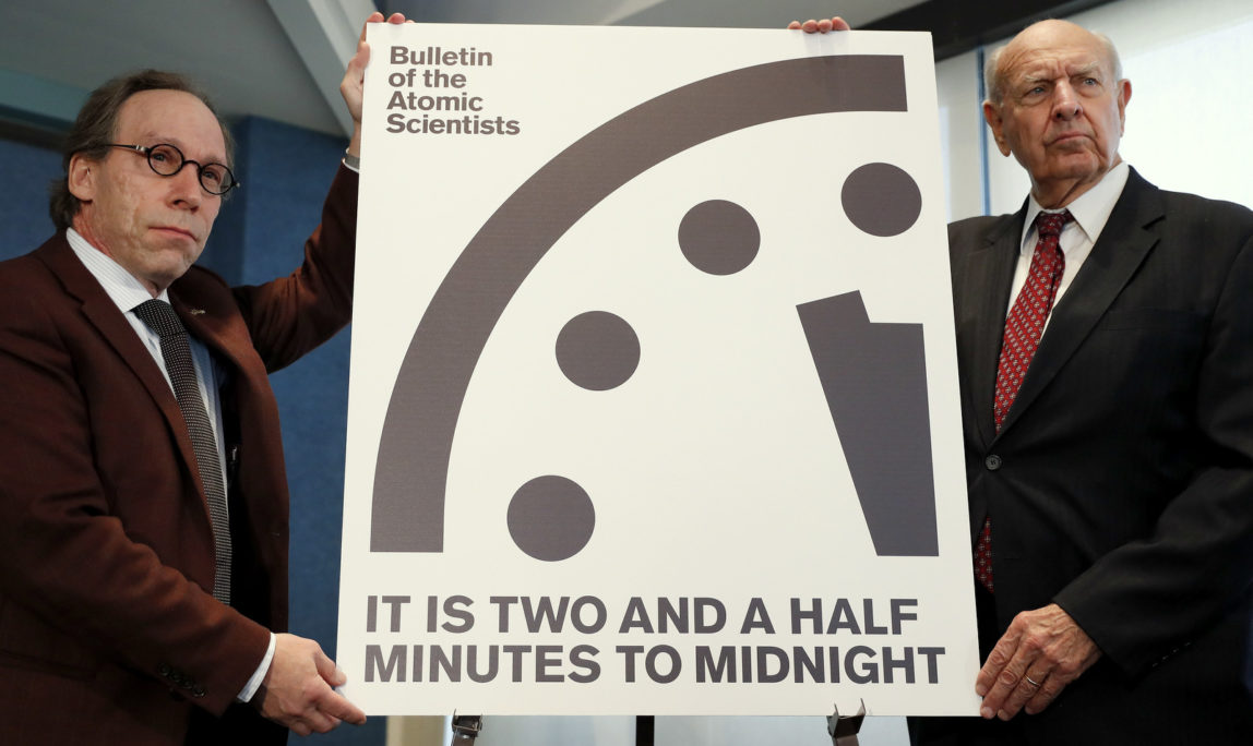 Lawrence Krauss, theoretical physicist, chair of the Bulletin of the Atomic Scientists Board of Sponsors, left, and Thomas Pickering, co-chair of the International Crisis Group, display the Doomsday Clock during a news conference the at the National Press Club in Washington, Thursday, Jan. 26, 2017, announcing that the Bulletin of the Atomic Scientist have moved the minute hand of the Doomsday Clock to two and a half minutes to midnight. (AP Photo/Carolyn Kaster)