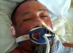 A still from footage of Anastacio Hernandez-Rojas after the incident shows him bruised in his hospital bed.