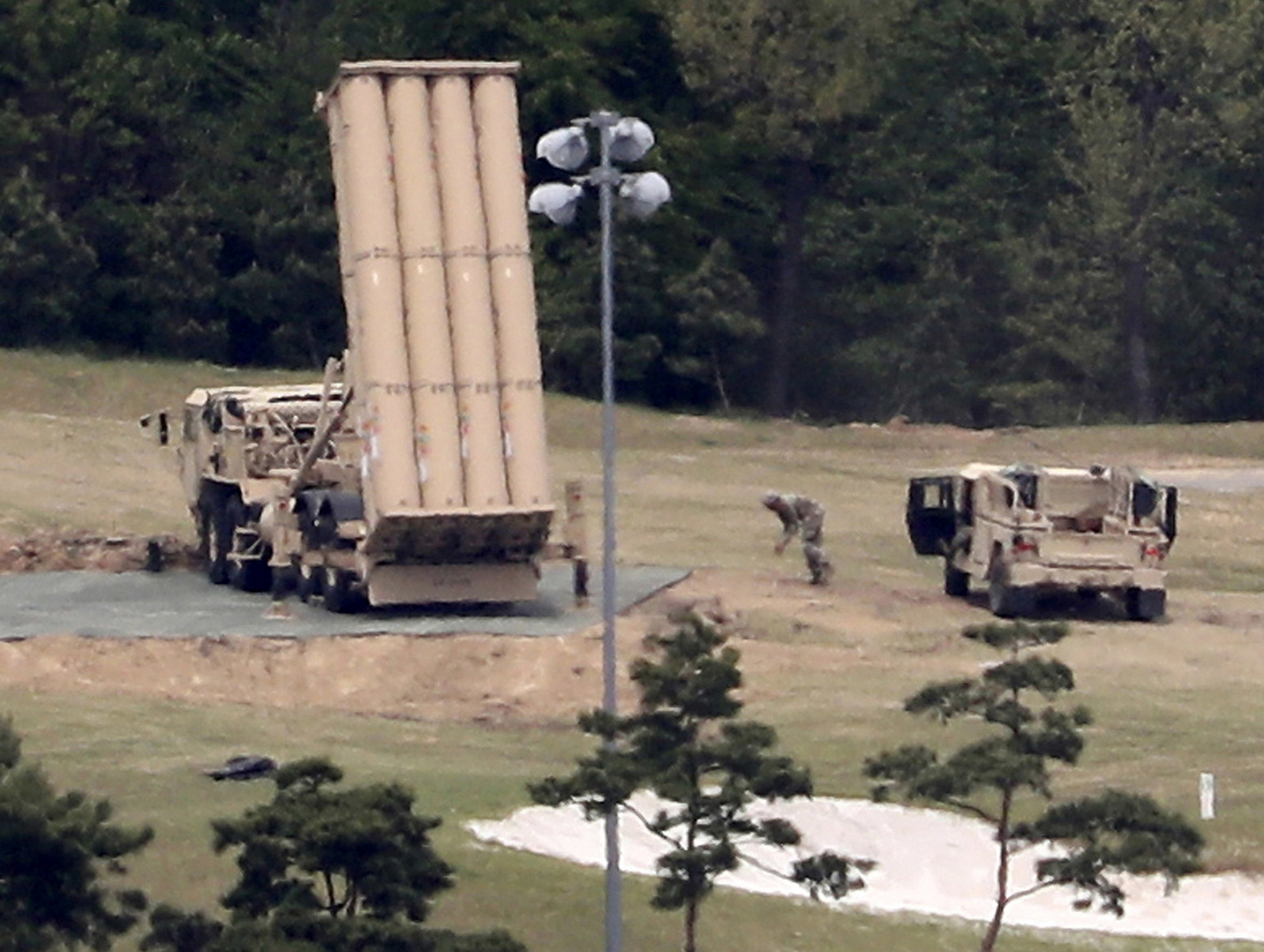 A U.S. missile defense system called Terminal High Altitude Area Defense, or THAAD, is installed on a golf course in Seongju, South Korea. (Kim Jun-beom/Yonhap via AP)
