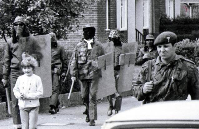 British troops and UDA members on joint patrol at Clon Duff Drive in Belfast, 1972 during the tumultuous times known as 'The Troubles.' 