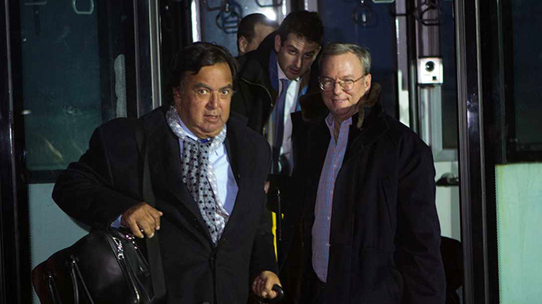 Former New Mexico Gov. Bill Richardson, left, and Executive Chairman of Google, Eric Schmidt, disembark from an airport transfer bus after arriving at Pyongyang International Airport in Pyongyang, North Korea, Jan. 7, 2013. Richardson called the trip to North Korea a private humanitarian visit. In the background is Google Ideas think tank director, Jared Cohen. (AP Photo/David Guttenfelder)