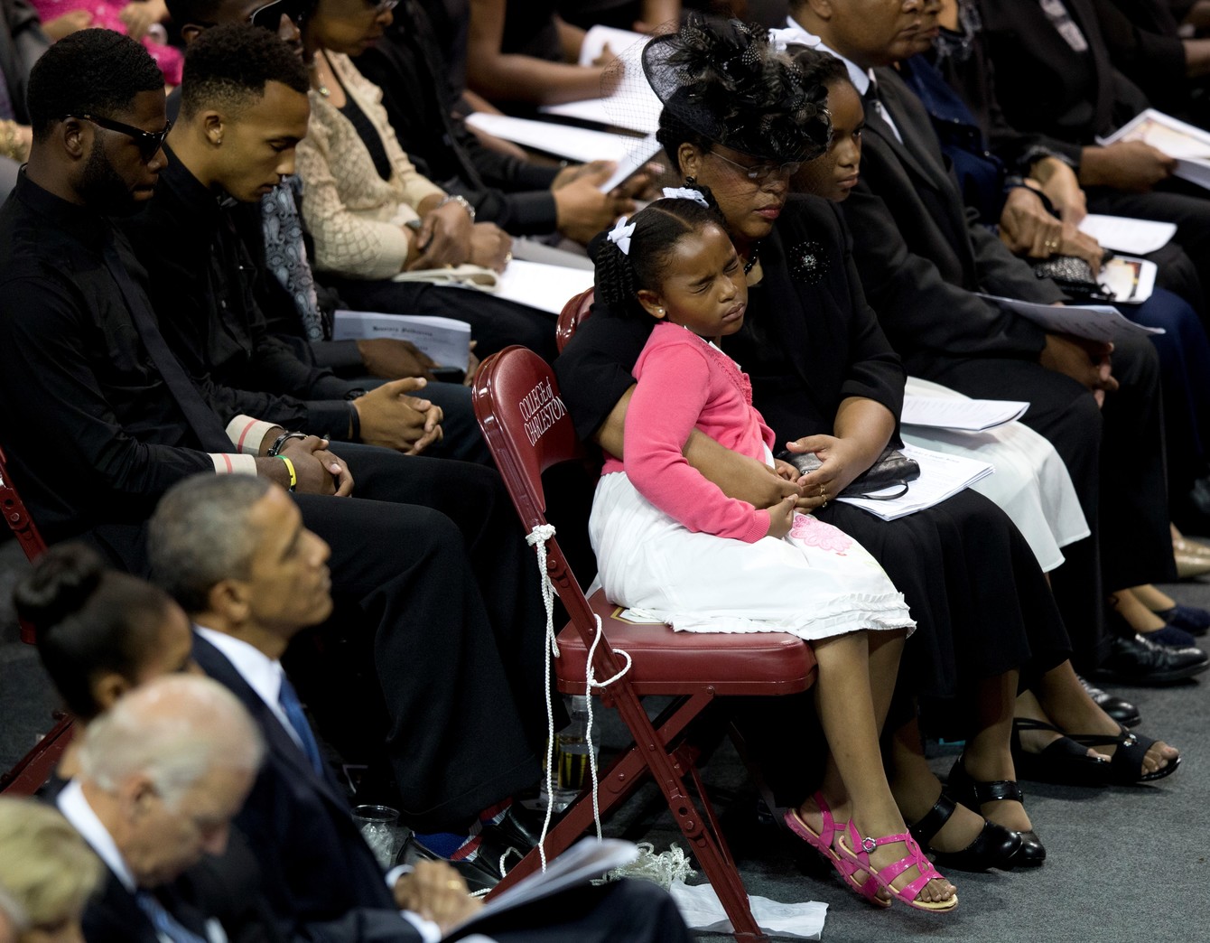 The widow of Clementa Pinckney, a pastor and South Carolina lawmaker slain in the mass murder at Charleston’s Mother Emanuel African Methodist Episcopal Church, hugs her daughter during a 2015 memorial service for victims of that attack. (AP/Carolyn Kaster)