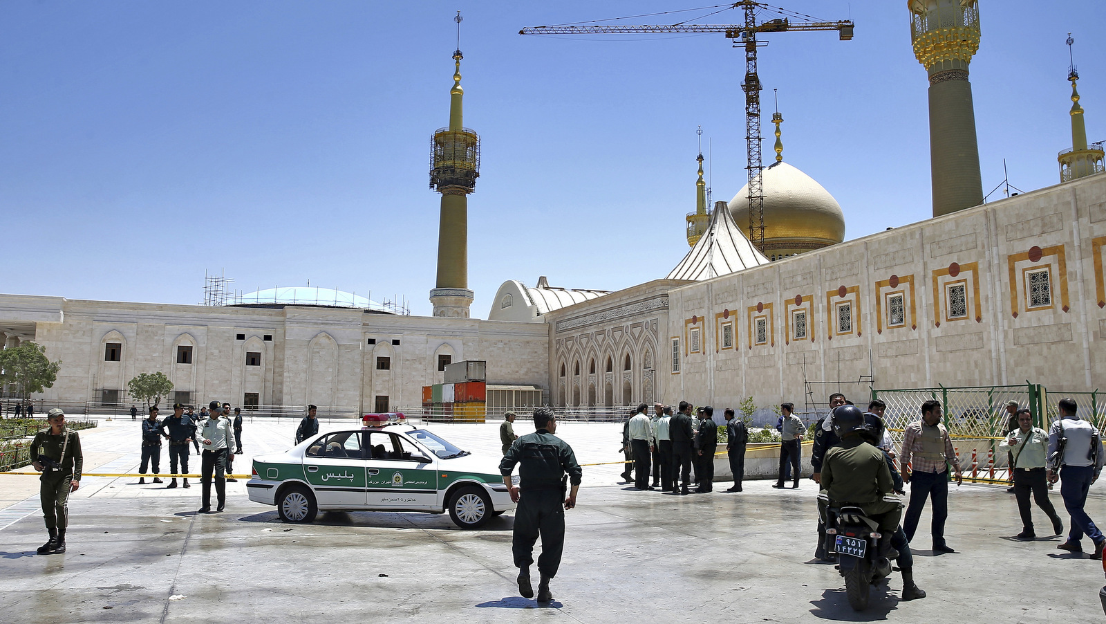 Police secure the scene around of shrine of late Iranian revolutionary founder Ayatollah Khomeini, after an assault by several attackers in Tehran, Iran, June 7, 2017. Suicide bombers and gunmen stormed into Iran's parliament and targeted the shrine of Ayatollah Ruhollah Khomeini on Wednesday, killing a security guard and wounding several other people in rare twin attacks, with the siege at the legislature still underway. (AP/Ebrahim Noroozi)