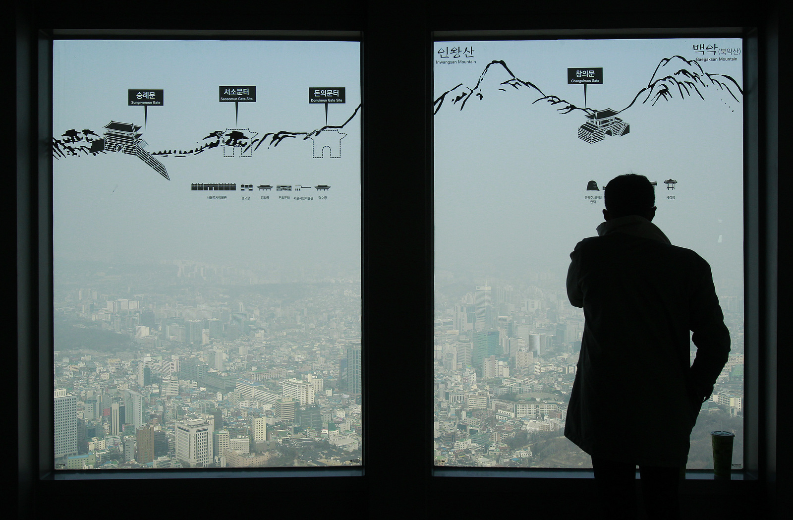 A man watches the Seoul skyline covered with a thick haze at Seoul Tower's observation deck in Seoul, South Korea. ( AP/Ahn Young-joon)