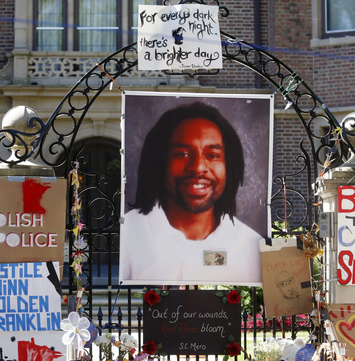 A memorial including a photo of Philando Castile adorns the gate to the governor's residence where protesters demonstrated in St. Paul, Minn., against the July 6 shooting death of Castile. (AP/Jim Mone)