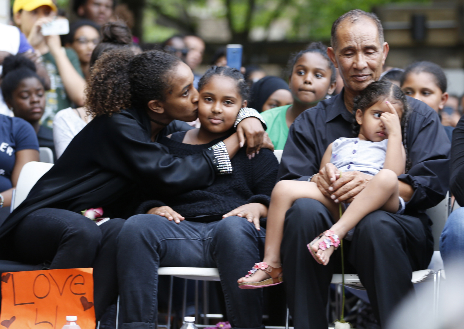 Mahmoud Hassanen Aboras father of Nabra Hassanen, who was killed over the weekend, sits with family as he listens to speakers during a vigil in honor of Nabra Wednesday, June 21, 2017, in Reston, Va. (AP/Steve Helber)
