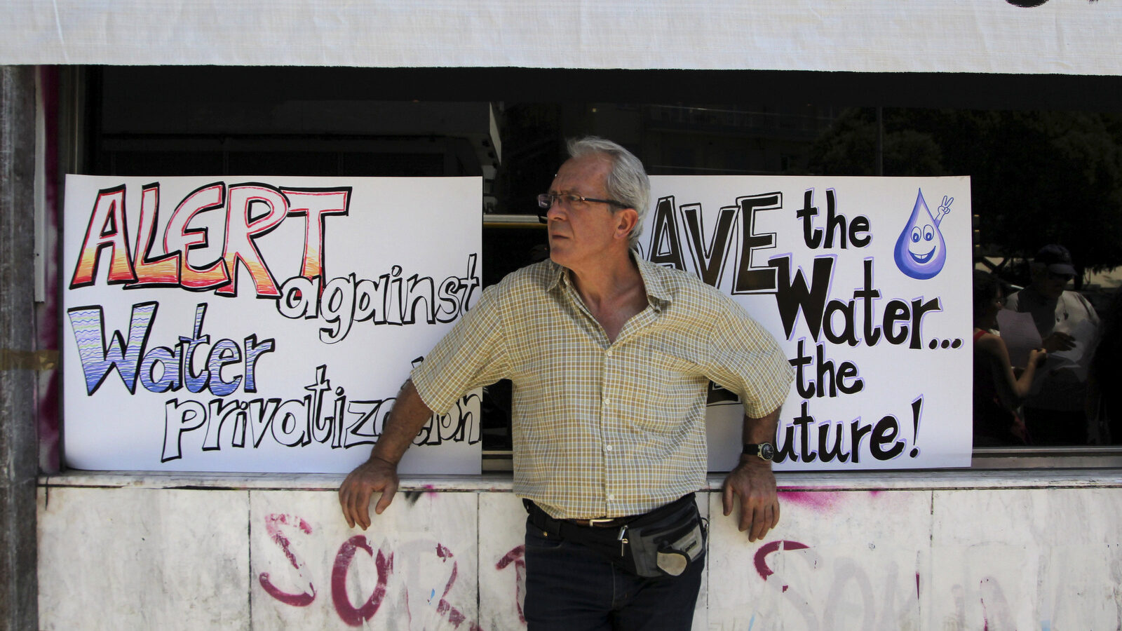 A protester takes part in a rally against the privatization of the state-run water utility, in Thessaloniki, Greece.(AP/Nikolas Giakoumidis)