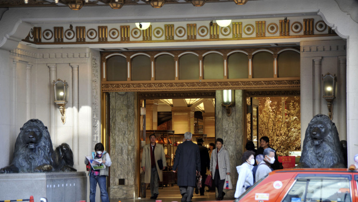 Shoppers walk by Mitsukoshi department store's flagship store in Tokyo's Nihonbashi business and commercial district, April 1, 2008. (AP/Katsumi Kasahara)