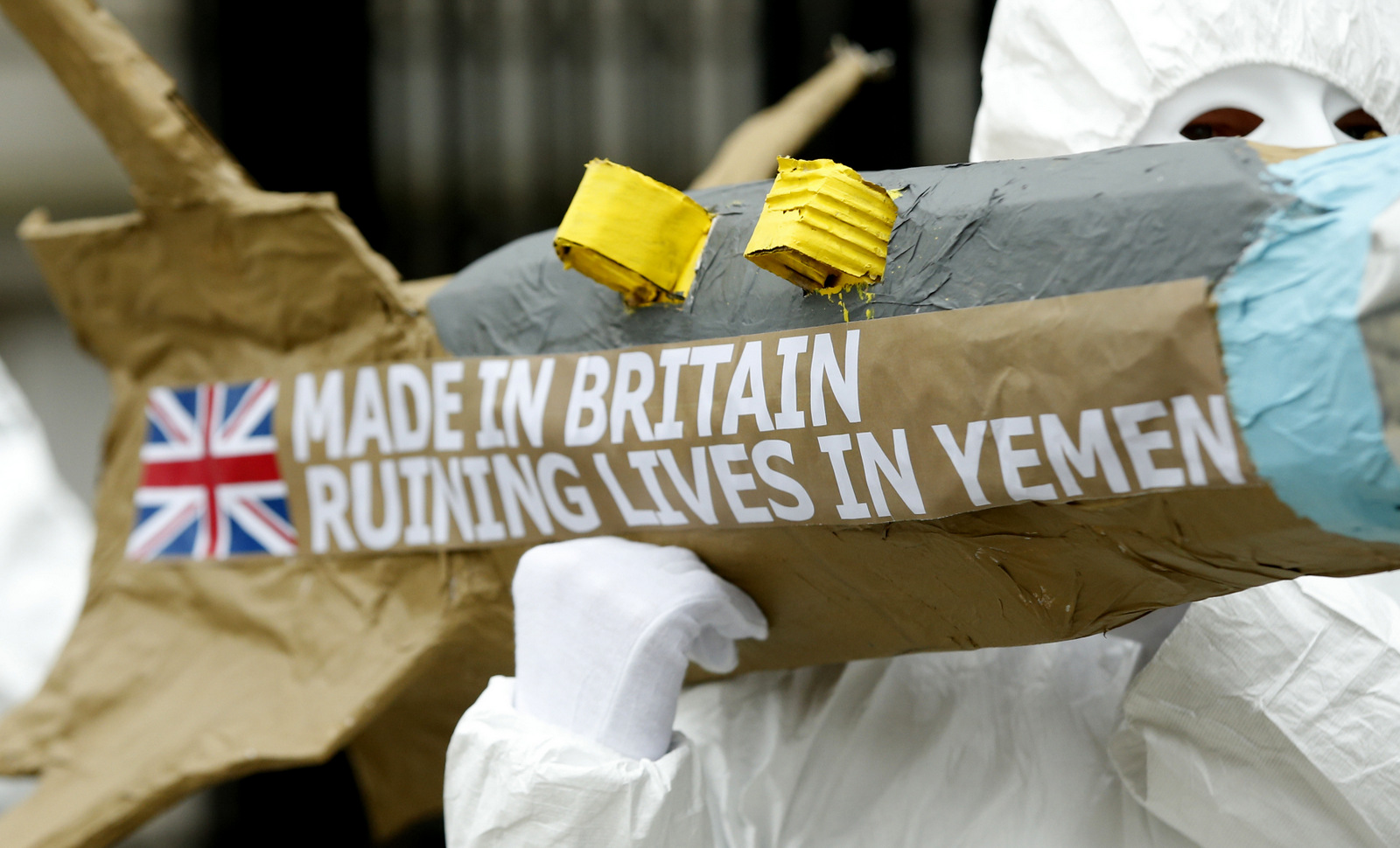 Amnesty International members protest by carrying a mock up of a missile, against the British Governments continued sale of arms to Saudi Arabia outside Downing Street in London, Friday, March,18, 2016. The demonstration is focusing on the use of British made weapons by Saudi Arabian forces in the armed conflict in Yemen. (AP/Alastair Grant)