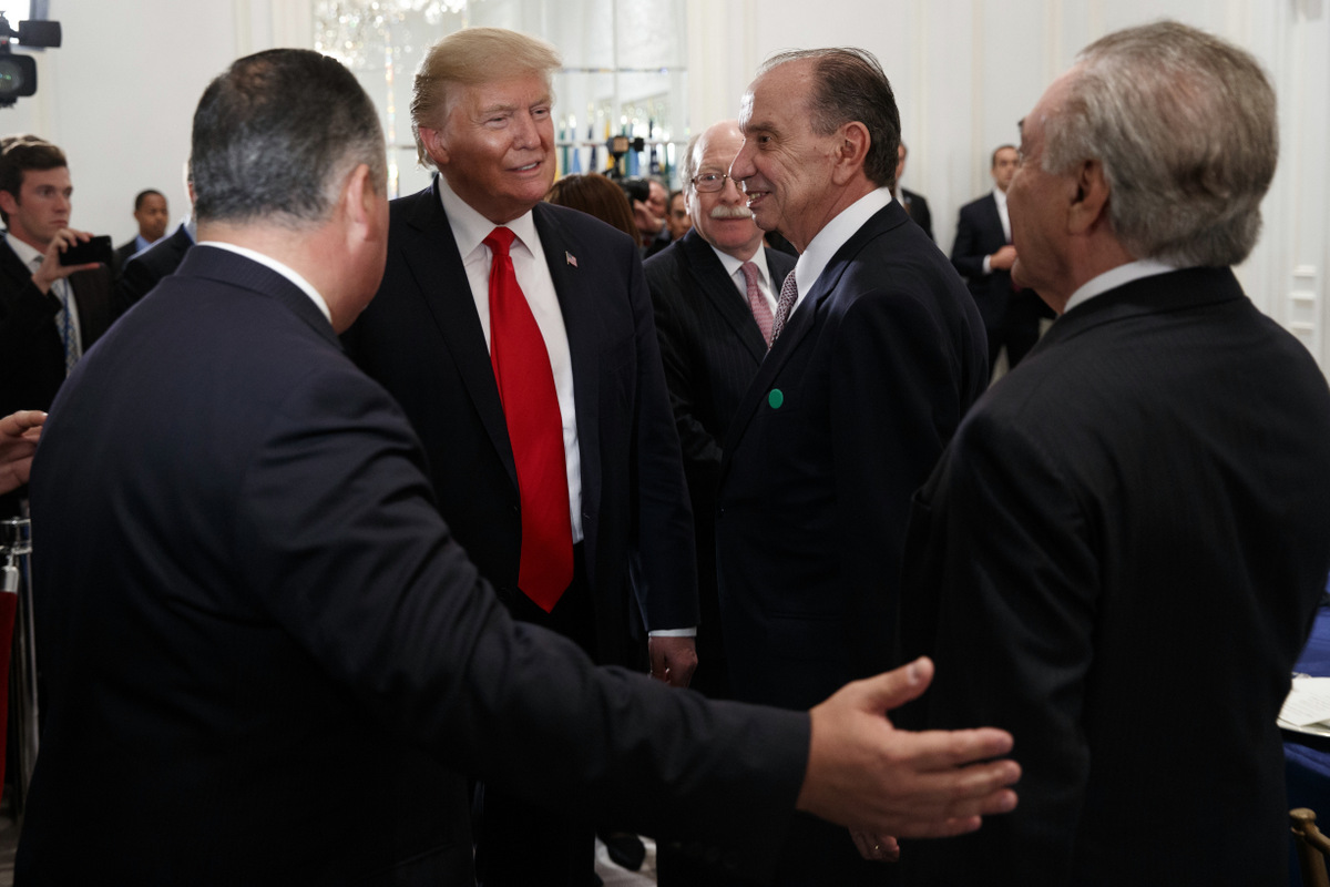 President Donald Trump, left, is greeted by Brazilian Foreign Minister Aloysio Nunes, center, and Brazilian President Michel Temer, right, as he arrives to a dinner with Latin American leaders at the Palace Hotel during the United Nations General Assembly, Sept. 18, 2017, in New York. (AP/Evan Vucci)